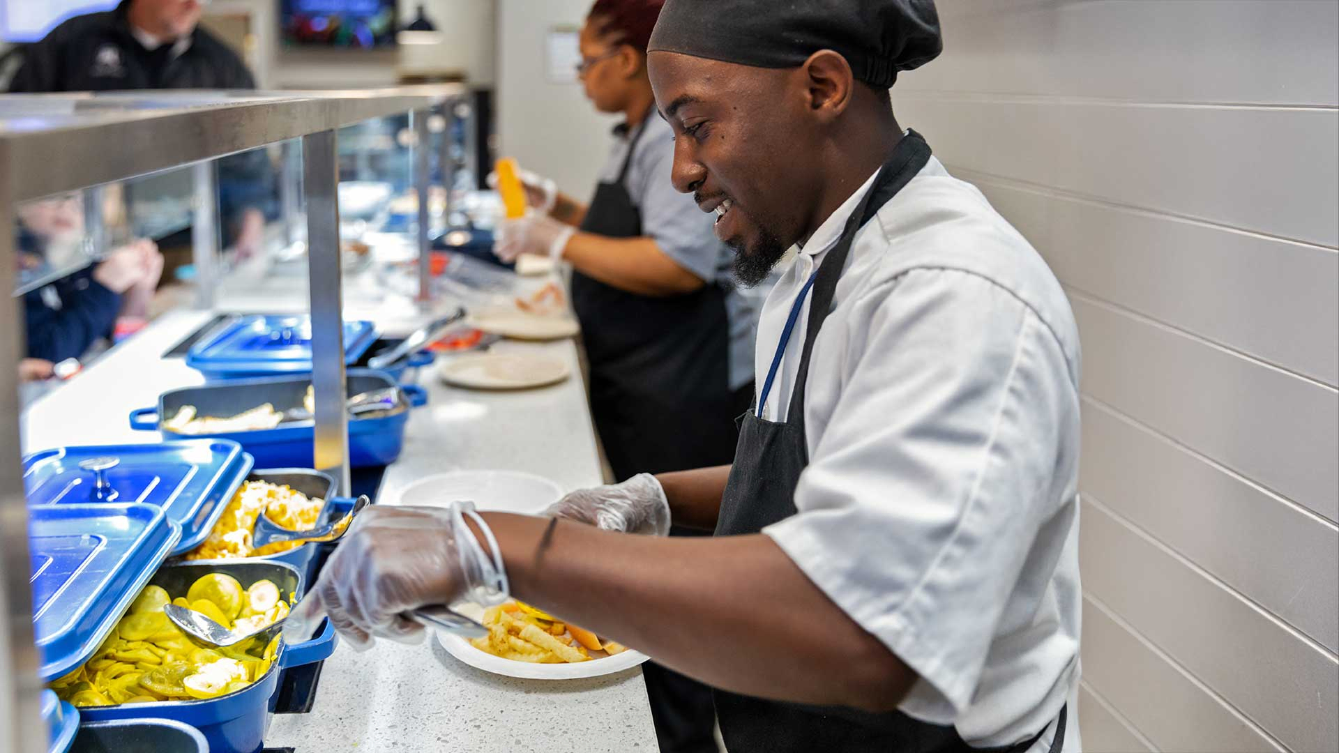 Cooking making a plate on serving line